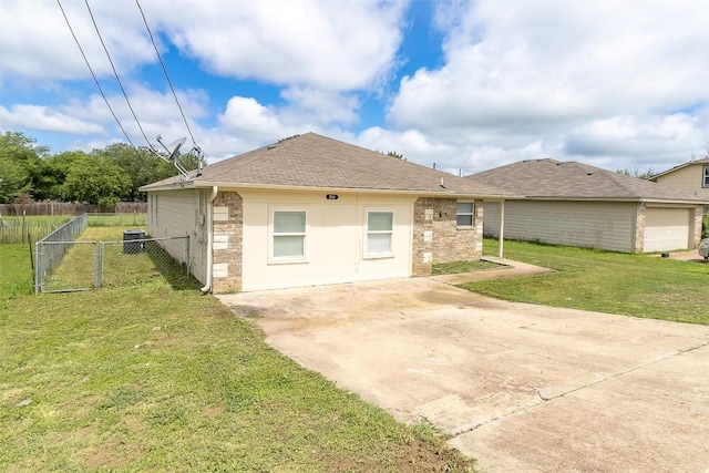 706 Brown St, Lampasas, TX 76550 - rear view of property with brick siding, a shingled roof, a gate, a patio area, and driveway