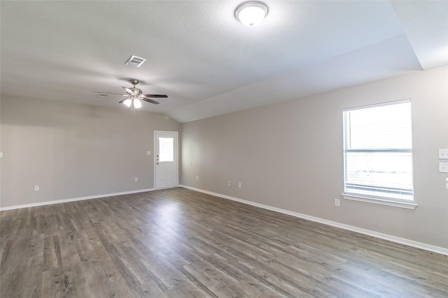 706 Brown St, Lampasas, TX 76550 - spare room featuring vaulted ceiling, ceiling fan, and wood finished floors