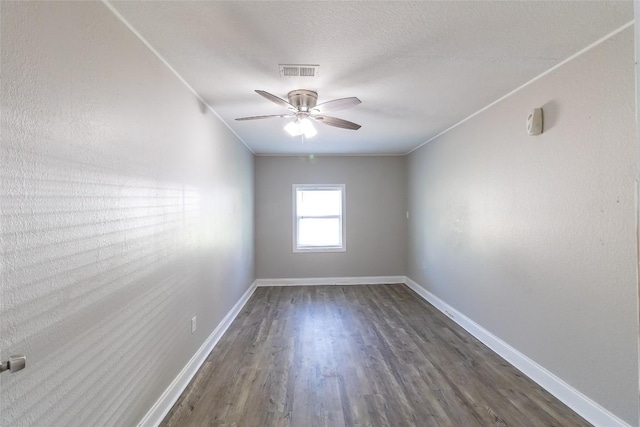 706 Brown St, Lampasas, TX 76550 - spare room with dark wood-style flooring and a ceiling fan