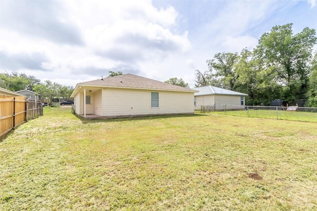 706 Brown St, Lampasas, TX 76550 - rear view of house with a fenced backyard