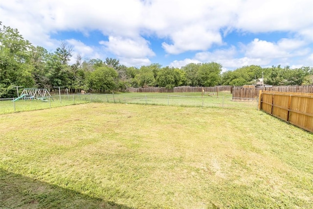 706 Brown St, Lampasas, TX 76550 - fenced backyard with a playground