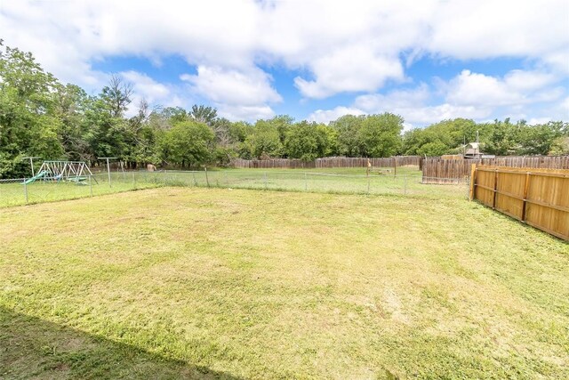 706 Brown St, Lampasas, TX 76550 - fenced backyard with a playground