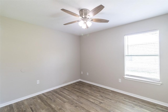 706 Brown St, Lampasas, TX 76550 - empty room featuring plenty of natural light, wood finished floors, and ceiling fan