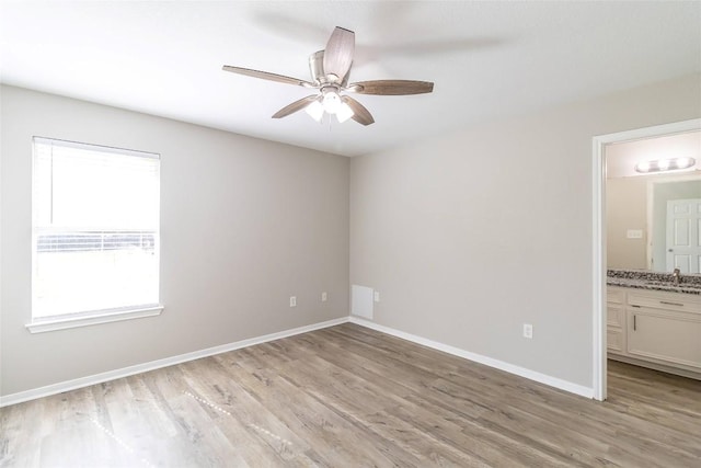 706 Brown St, Lampasas, TX 76550 - unfurnished room featuring light wood-type flooring and ceiling fan