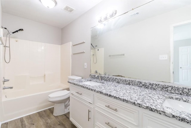 706 Brown St, Lampasas, TX 76550 - full bathroom with vanity, shower / tub combination, and wood finished floors