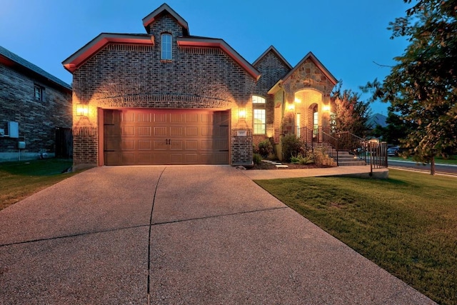 100 Crystal Cv, Round Rock, TX 78664 - french country inspired facade with a front yard, driveway, brick siding, and a garage