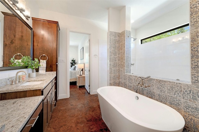 2471 George Pass, Canyon Lake, TX 78133 - bathroom featuring vanity, a freestanding tub, ensuite bathroom, and concrete floors