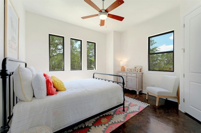 2471 George Pass, Canyon Lake, TX 78133 - bedroom featuring finished concrete floors and ceiling fan