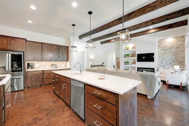 2471 George Pass, Canyon Lake, TX 78133 - kitchen featuring appliances with stainless steel finishes, finished concrete floors, decorative backsplash, light countertops, and hanging light fixtures