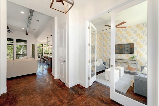 2471 George Pass, Canyon Lake, TX 78133 - corridor featuring concrete floors, wallpapered walls, and lofted ceiling
