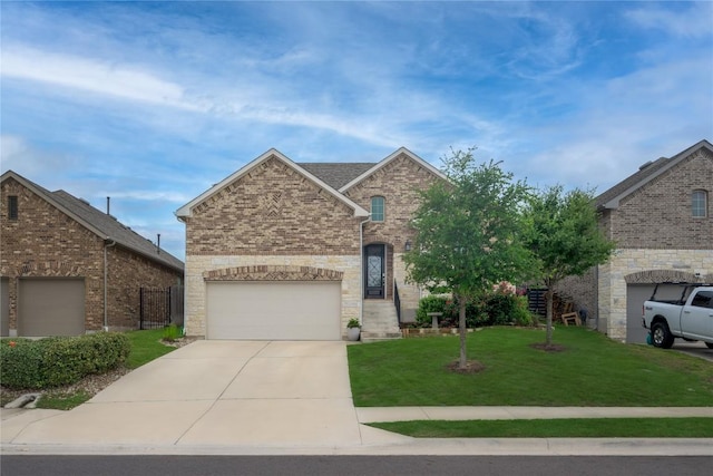 5612 Wild Foxglove Rd, Spicewood, TX 78669 - traditional home with concrete driveway, a front lawn, an attached garage, and brick siding