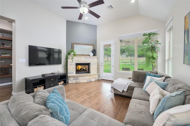 5612 Wild Foxglove Rd, Spicewood, TX 78669 - living area featuring a ceiling fan, lofted ceiling, a fireplace, wood finished floors, and recessed lighting