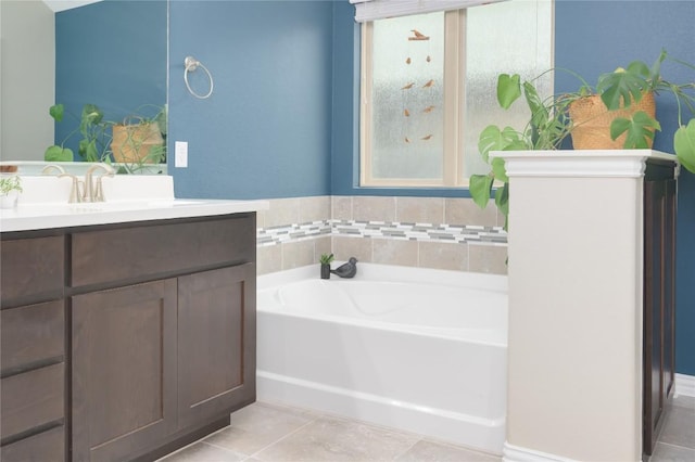 5612 Wild Foxglove Rd, Spicewood, TX 78669 - bathroom with a garden tub, vanity, and tile patterned flooring