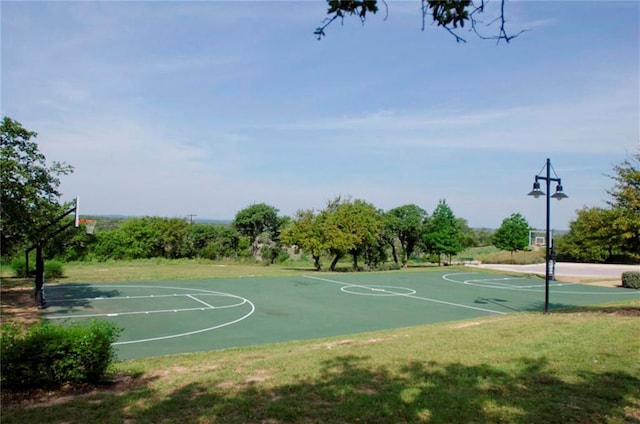 5612 Wild Foxglove Rd, Spicewood, TX 78669 - view of basketball court featuring community basketball court and a lawn