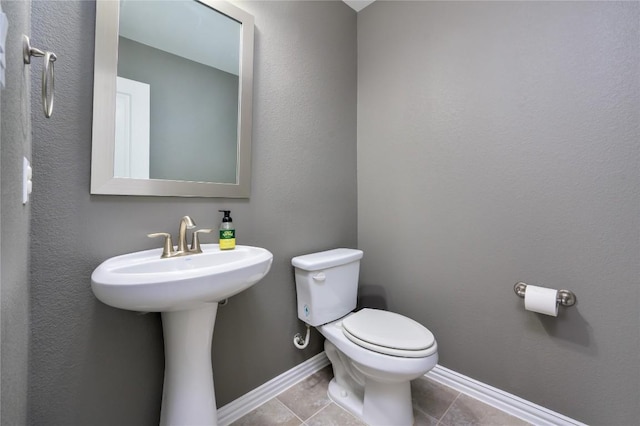 5612 Wild Foxglove Rd, Spicewood, TX 78669 - bathroom with toilet and tile patterned flooring