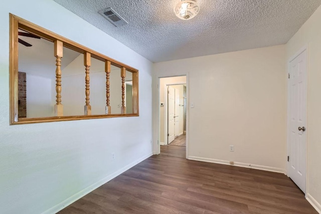 2112 Cindy Ln, Austin, TX 78727 - spare room with wood finished floors and a textured ceiling