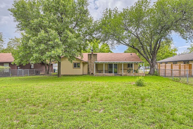 2112 Cindy Ln, Austin, TX 78727 - rear view of property with a fenced backyard and a chimney