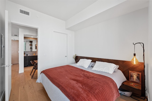 44 E Ave Unit 1404, Austin, TX 78701 - bedroom featuring light wood-type flooring