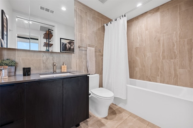 44 E Ave Unit 1404, Austin, TX 78701 - bathroom featuring tile walls, vanity, shower / bathtub combination with curtain, decorative backsplash, and recessed lighting