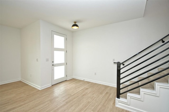 7601 Cooper Ln Unit 25, Austin, TX 78745 - entrance foyer featuring stairway and light wood-style flooring