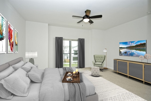 7601 Cooper Ln Unit 25, Austin, TX 78745 - carpeted bedroom with ceiling fan and baseboards