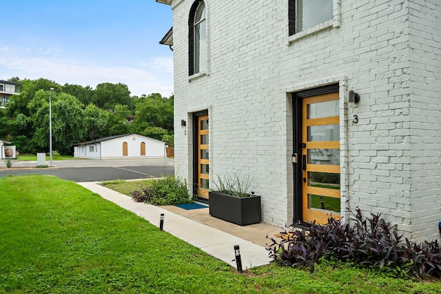 1206 Hollow Creek Dr Unit 3, Austin, TX 78704 - property entrance with brick siding and a lawn