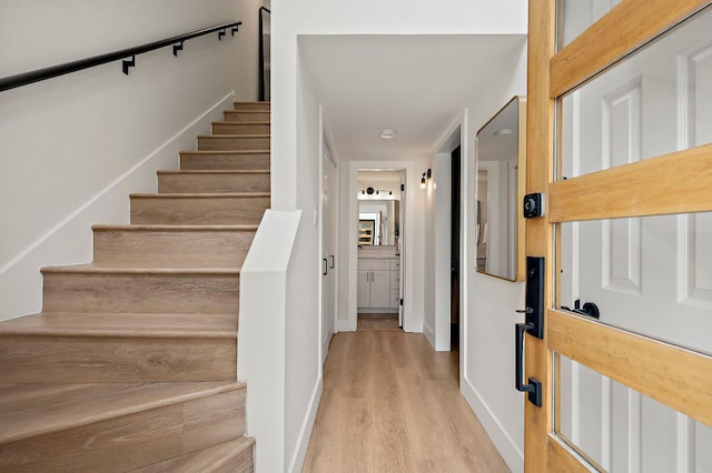 1206 Hollow Creek Dr Unit 3, Austin, TX 78704 - staircase featuring wood finished floors and baseboards