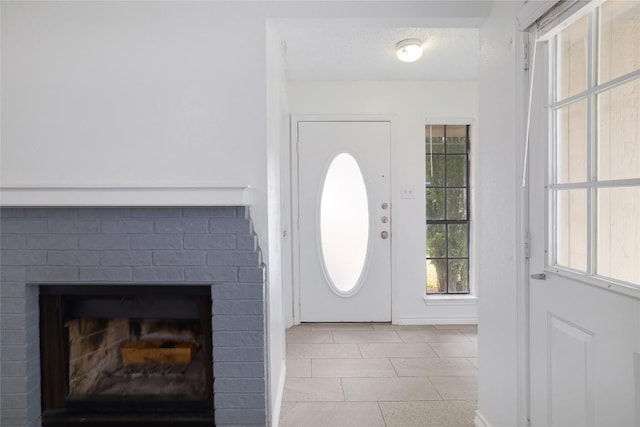 9206 Kempler Dr, Austin, TX 78748 - tiled entrance foyer featuring a brick fireplace