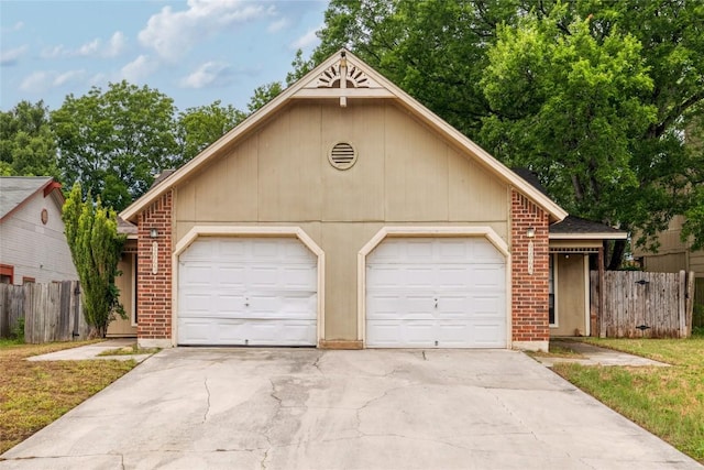 9206 Kempler Dr, Austin, TX 78748 - view of front of house featuring a garage, brick siding, and driveway