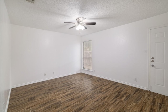 9206 Kempler Dr, Austin, TX 78748 - unfurnished room featuring dark wood-style floors, ceiling fan, and a textured ceiling