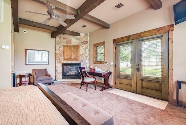 171 Oak Grove Cv, Georgetown, TX 78628 - bedroom featuring beamed ceiling, access to exterior, carpet, french doors, and a fireplace