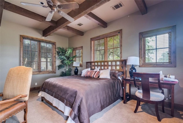 171 Oak Grove Cv, Georgetown, TX 78628 - bedroom featuring light colored carpet, beam ceiling, and ceiling fan