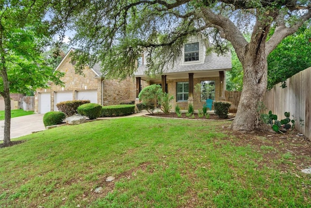 908 Golden Palomino Ct, Austin, TX 78732 - view of front facade featuring driveway, stone siding, roof with shingles, and an attached garage