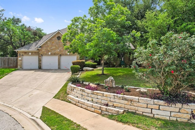 908 Golden Palomino Ct, Austin, TX 78732 - view of front of property featuring driveway, an attached garage, stone siding, and a shingled roof