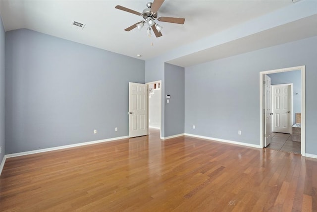 908 Golden Palomino Ct, Austin, TX 78732 - spare room with a ceiling fan, light wood-style floors, and lofted ceiling
