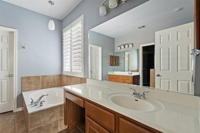 908 Golden Palomino Ct, Austin, TX 78732 - bathroom with vanity, a garden tub, and tile patterned floors