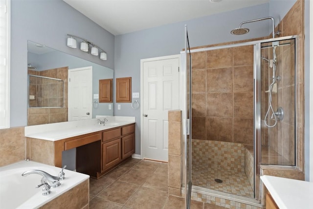 908 Golden Palomino Ct, Austin, TX 78732 - bathroom featuring vanity, a shower stall, a bath, and tile patterned floors