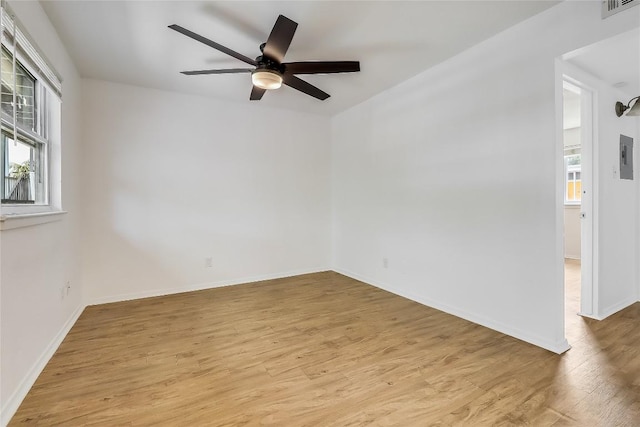 2401 Manor Rd Unit 210, Austin, TX 78722 - unfurnished room featuring wood finished floors, a ceiling fan, and electric panel