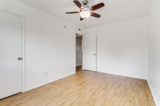 2401 Manor Rd Unit 210, Austin, TX 78722 - unfurnished room featuring ceiling fan and wood finished floors