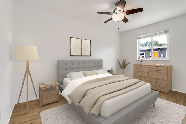 2401 Manor Rd Unit 210, Austin, TX 78722 - bedroom with light wood finished floors and a ceiling fan