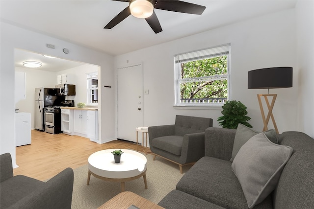 2401 Manor Rd Unit 210, Austin, TX 78722 - living area featuring light wood-type flooring and ceiling fan