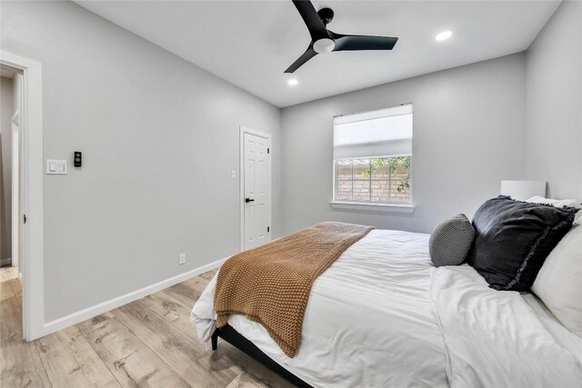 203 Sailors Run, Lakeway, TX 78734 - bedroom featuring light wood finished floors, recessed lighting, and ceiling fan