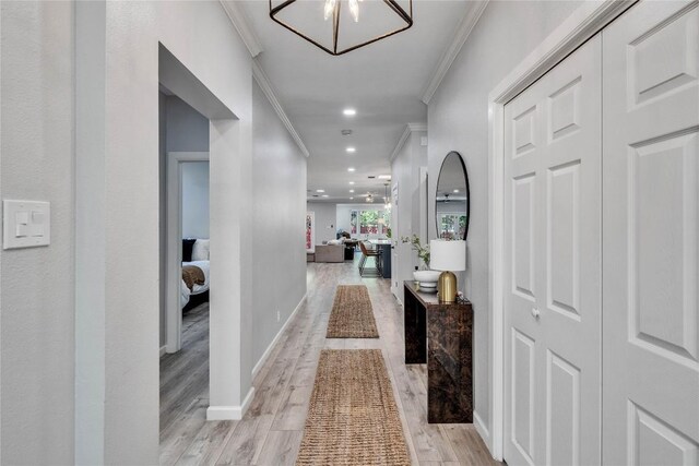 203 Sailors Run, Lakeway, TX 78734 - hall with ornamental molding, light wood finished floors, and recessed lighting