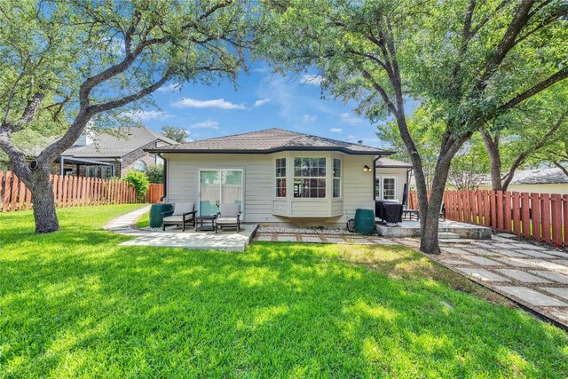 203 Sailors Run, Lakeway, TX 78734 - rear view of property with a patio and a fenced backyard