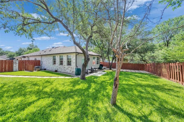 203 Sailors Run, Lakeway, TX 78734 - fenced backyard with a patio area