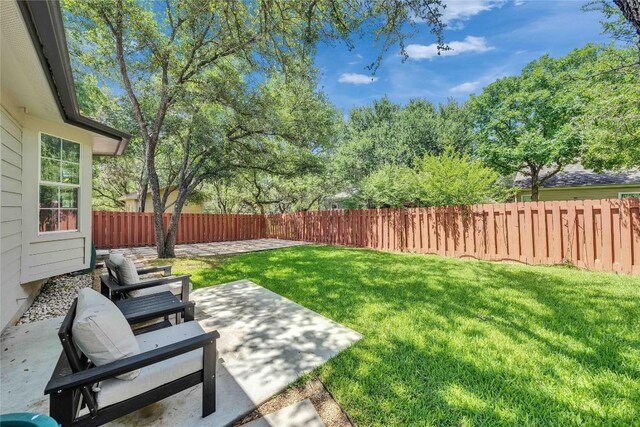 203 Sailors Run, Lakeway, TX 78734 - fenced backyard featuring a patio area