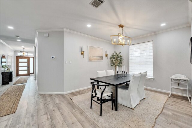 203 Sailors Run, Lakeway, TX 78734 - dining room with a chandelier, crown molding, light wood finished floors, and recessed lighting