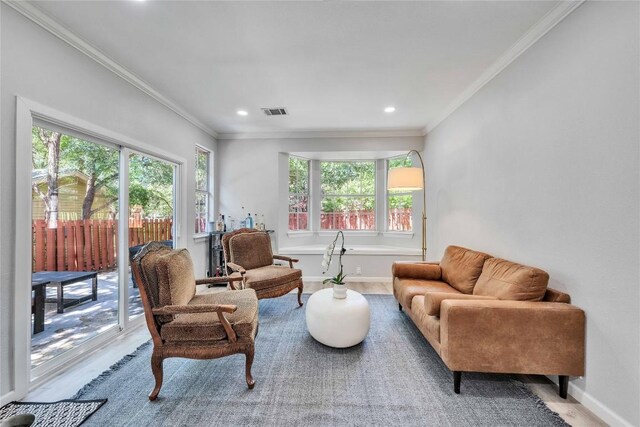 203 Sailors Run, Lakeway, TX 78734 - living room featuring healthy amount of natural light, wood finished floors, ornamental molding, and recessed lighting