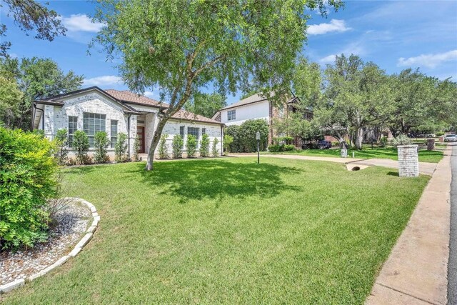 203 Sailors Run, Lakeway, TX 78734 - view of front of home featuring a front yard