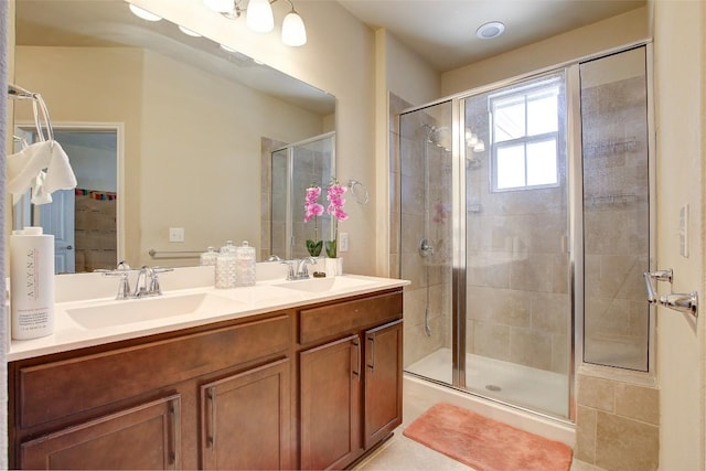 417 Epiphany Ln, Pflugerville, TX 78660 - bathroom featuring a stall shower and double vanity